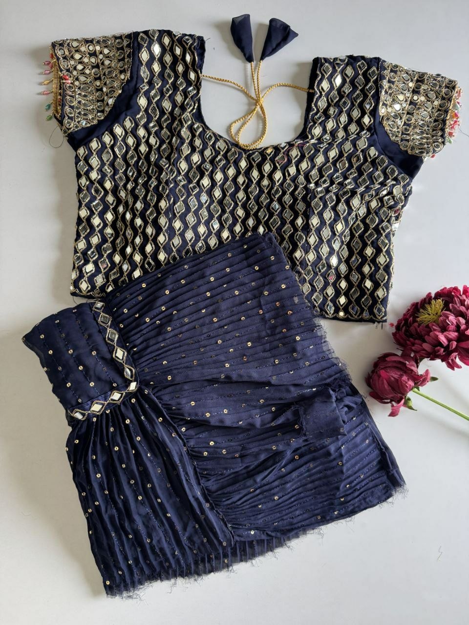 Saree with pleats and stitched blouse