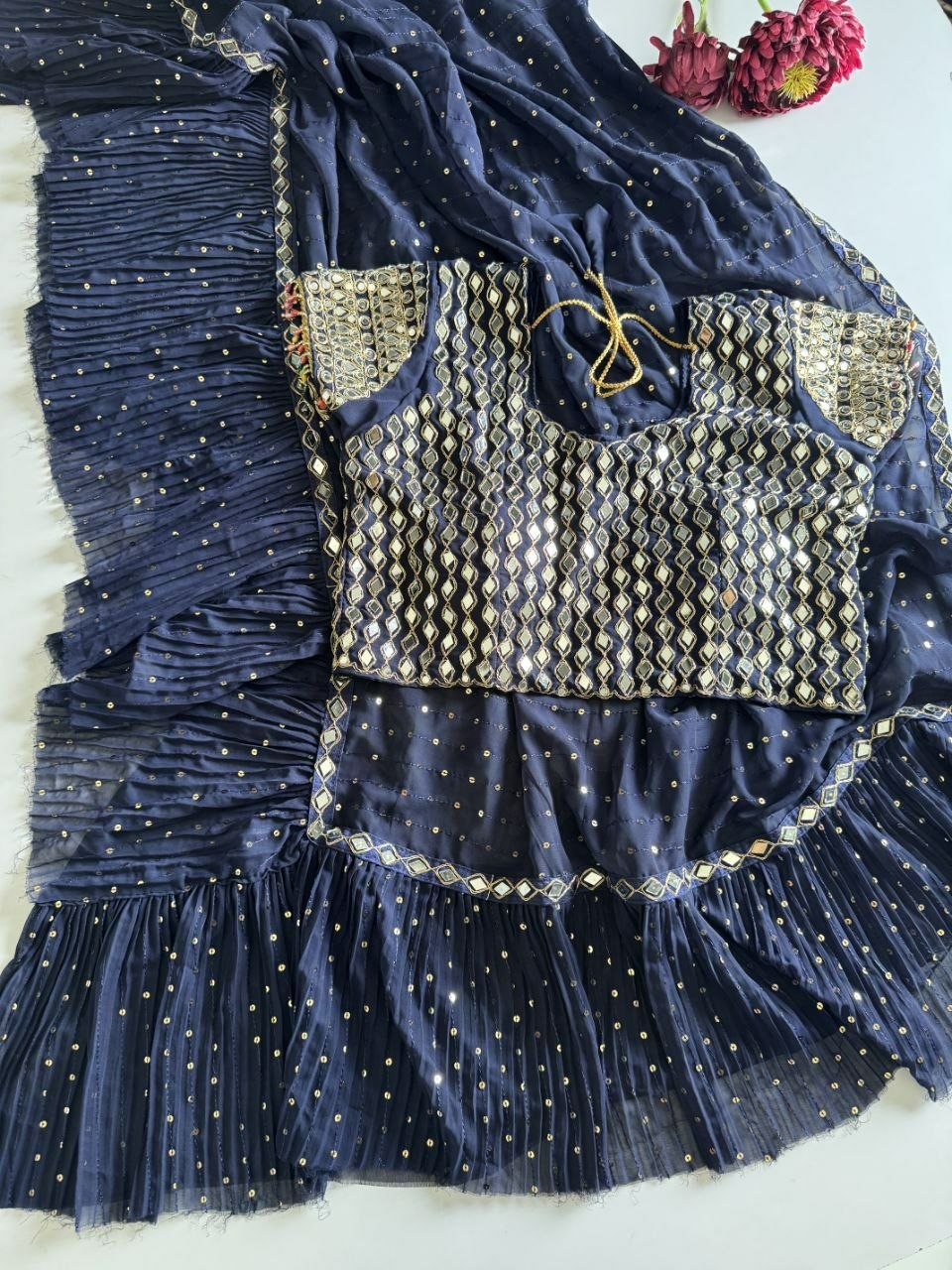 Saree with pleats and stitched blouse